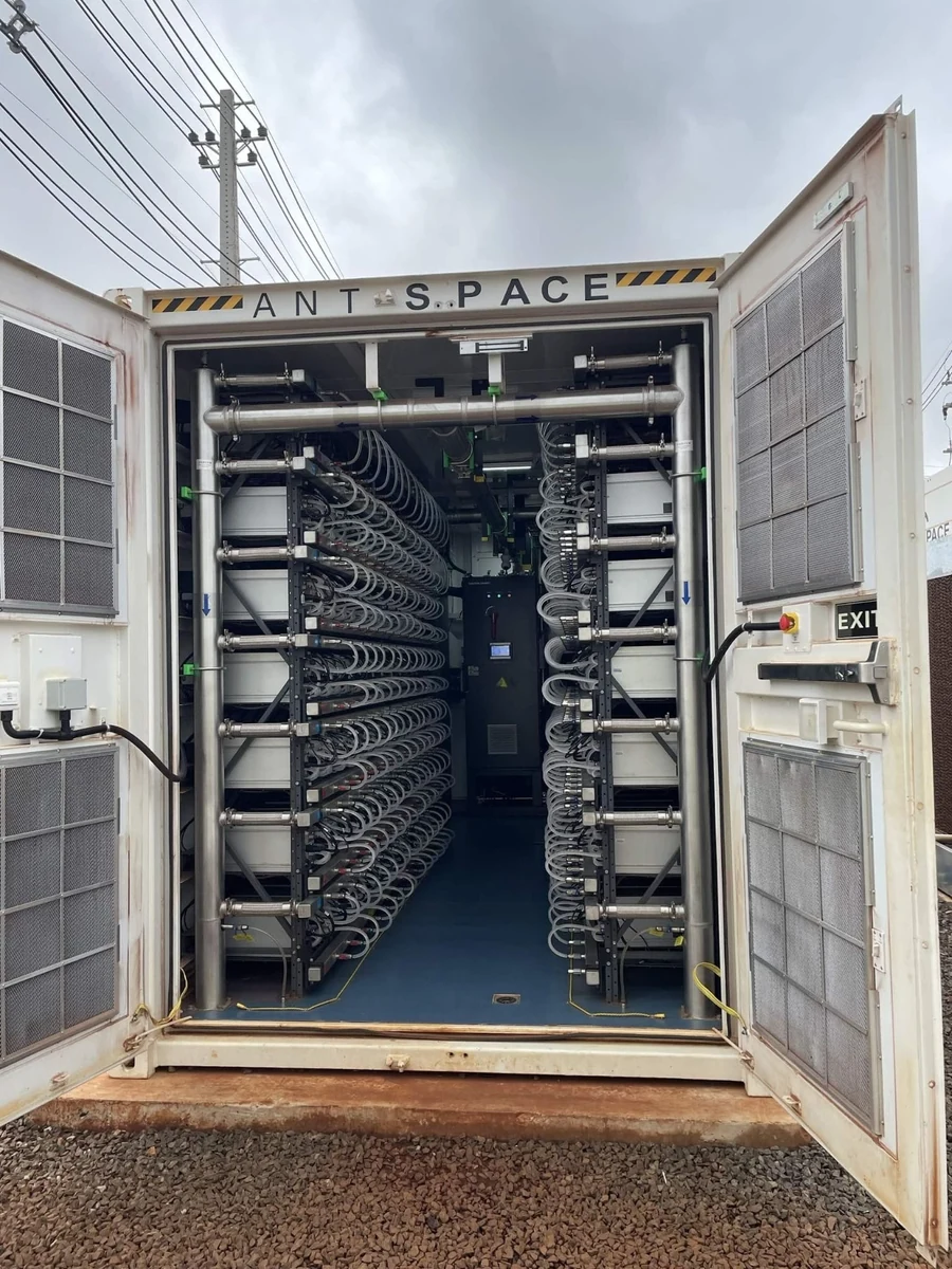 Contextual photo: open mining container at HIVE Digital’s Yguazú site, as published by Hashrate Index. This is not a LuxOS installation screenshot.