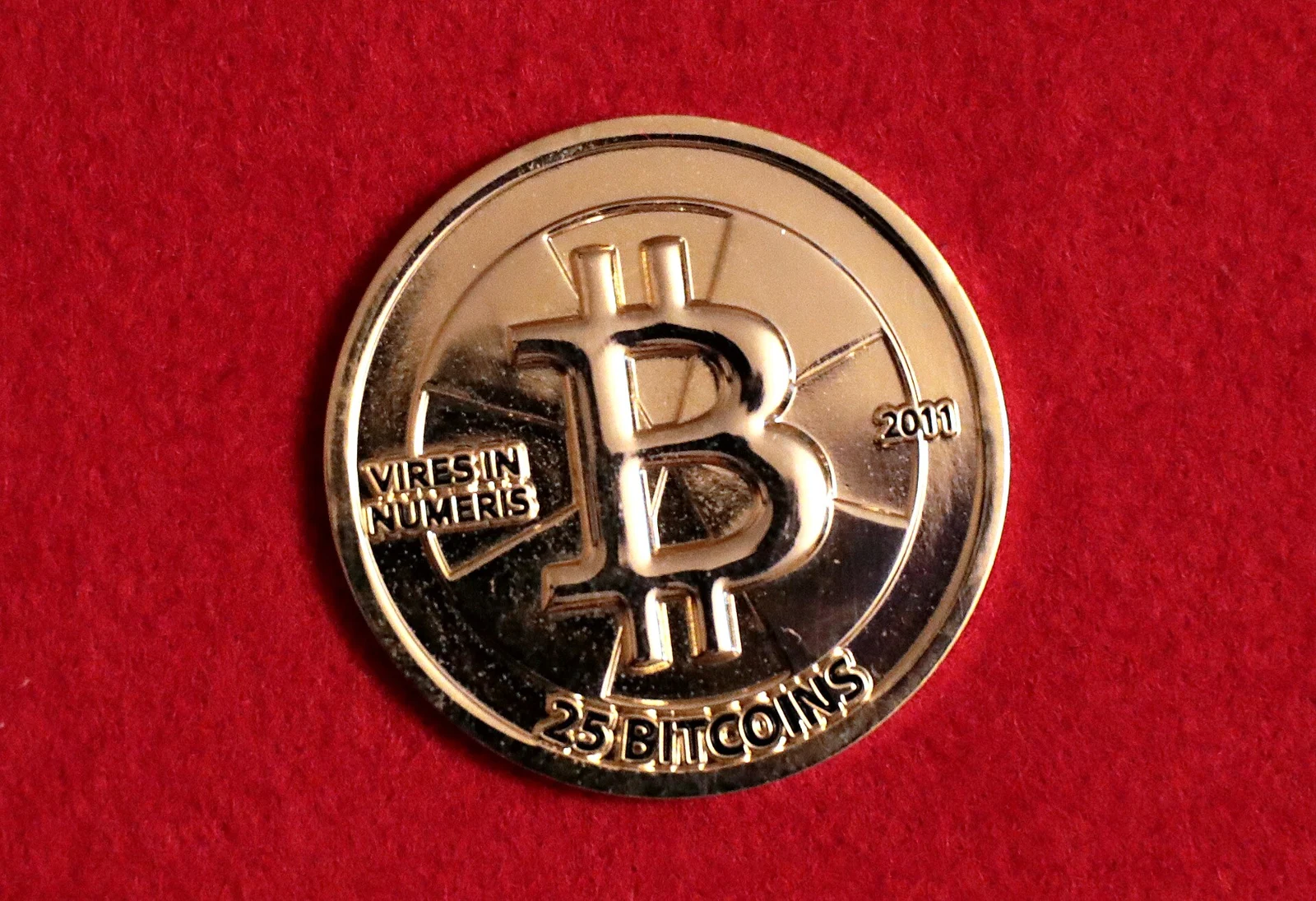 Physical Casascius Bitcoin token; archive illustration, not an ETF share or transaction