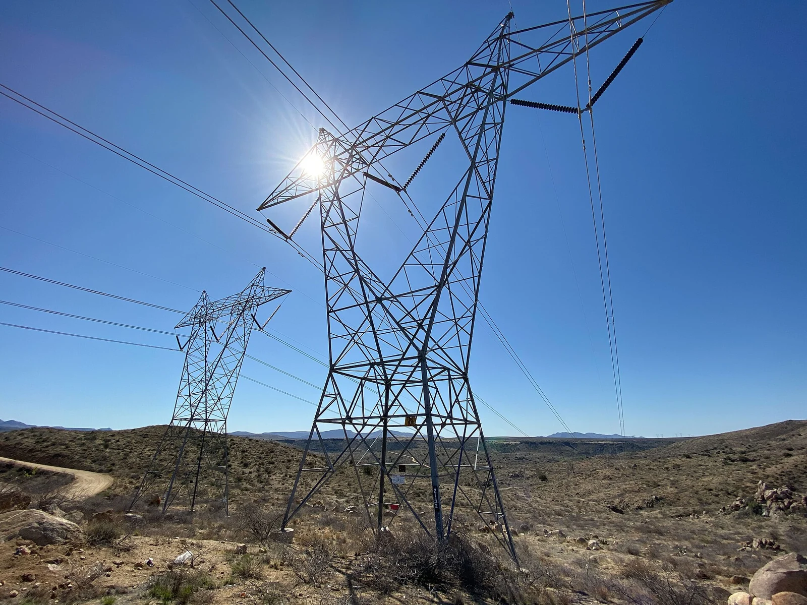 Archive photograph of transmission lines in Arizona, illustrating grid infrastructure rather than the PJM project sites