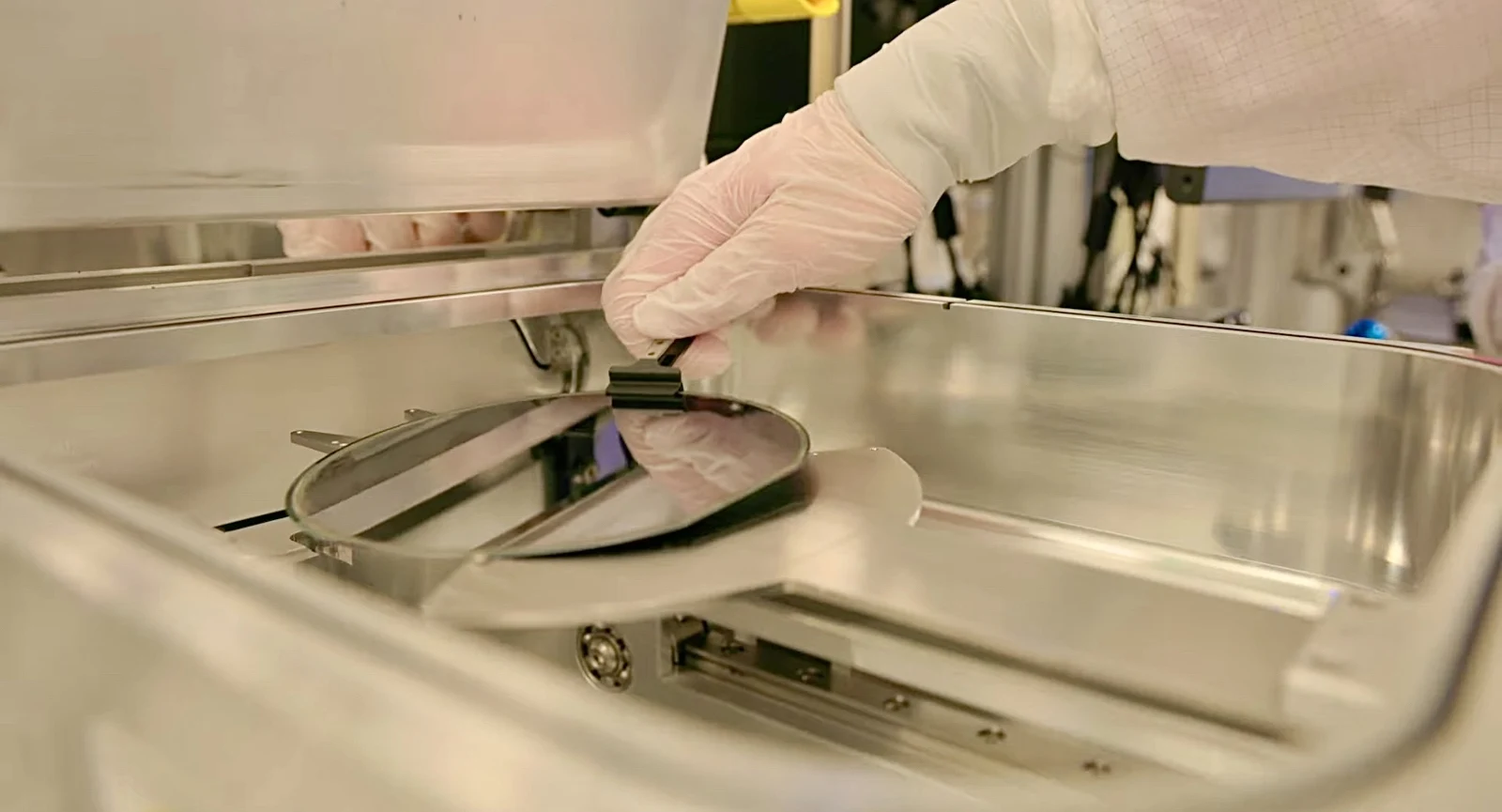 Archive semiconductor wafer processing photograph; thematic illustration, not the Xanadu–GlobalFoundries production line