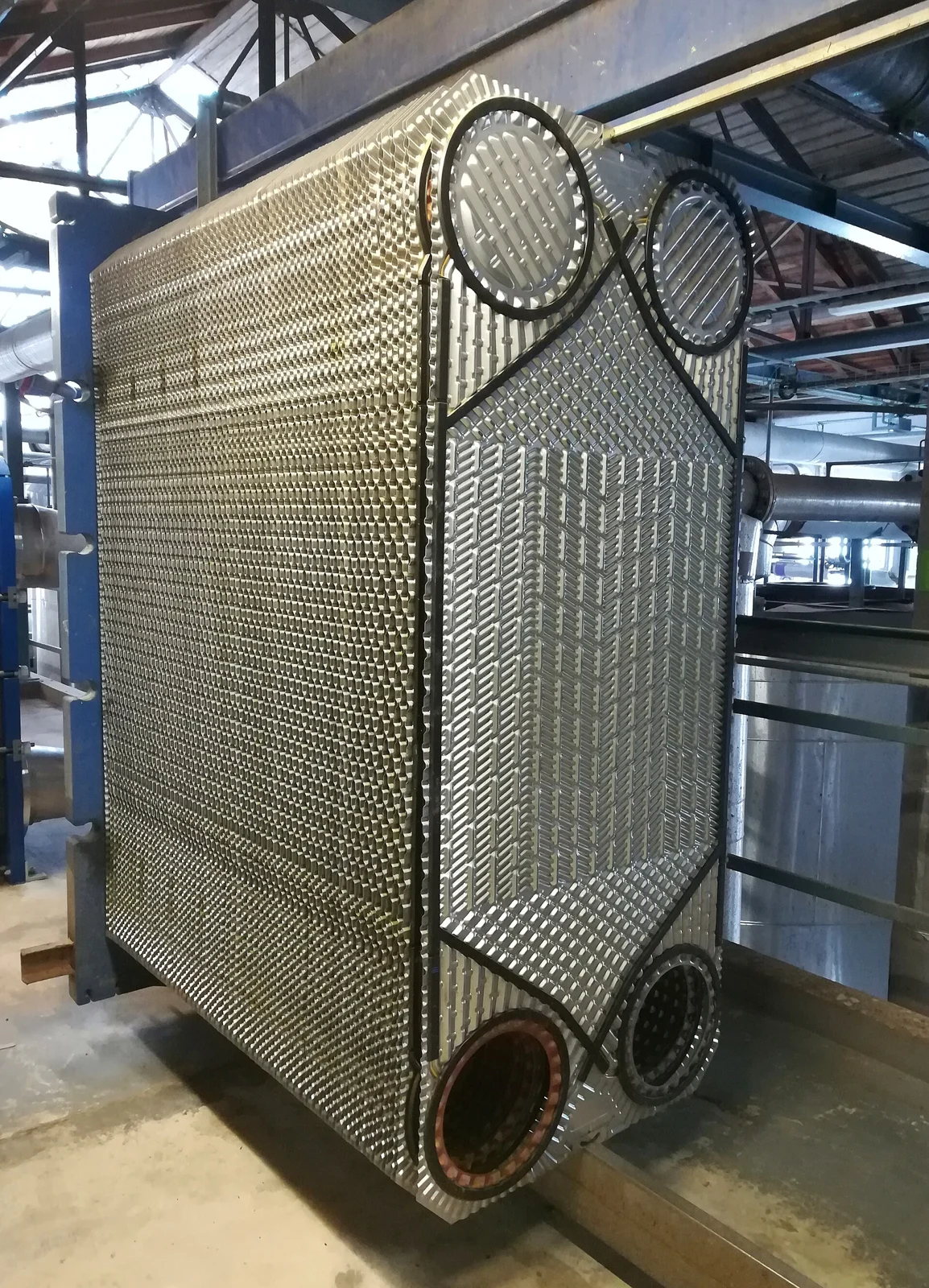 Archival dismantled plate heat exchanger illustrating loop hardware; not a Shell or NVIDIA product