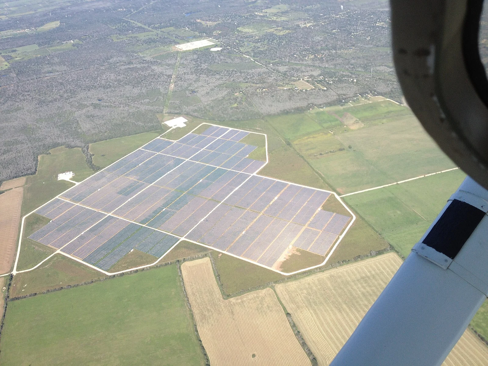 Aerial view of Webberville Solar Farm in Texas; archival context, not Sangha’s Project Genesis